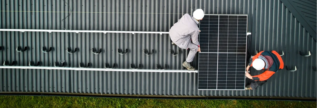 Engineer fitting solar panels